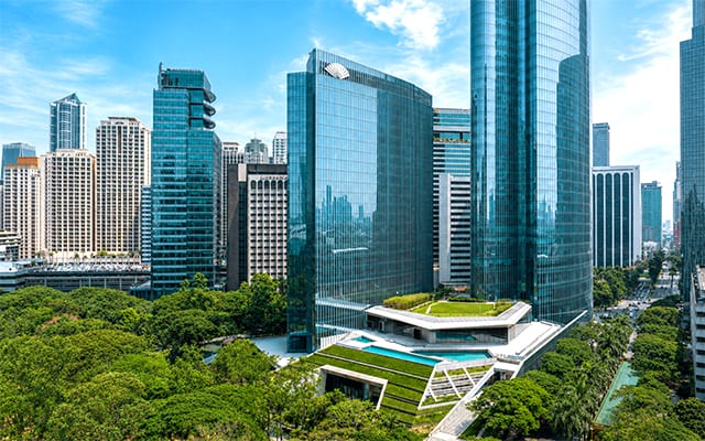 The new Mandarin Oriental Makati Manila stands above the Ayala Triangle Gardens in Makati City.